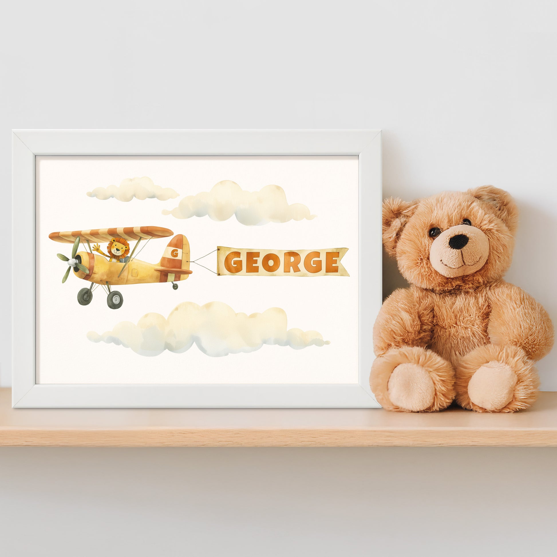 Framed illustration of a vintage plane with a personalised name banner and a teddy bear on a shelf.