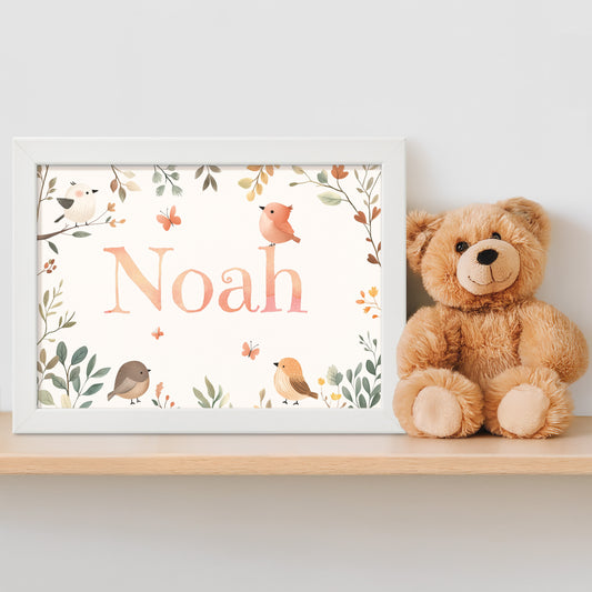 Personalised framed children's name print with nature illustrations with birds and butterflies in a woodland theme next to a teddy bear on a shelf.